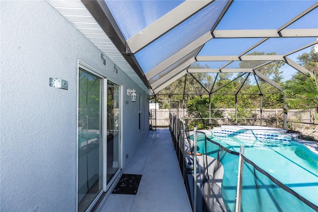 view of swimming pool with a patio, a fenced backyard, a fenced in pool, and a lanai