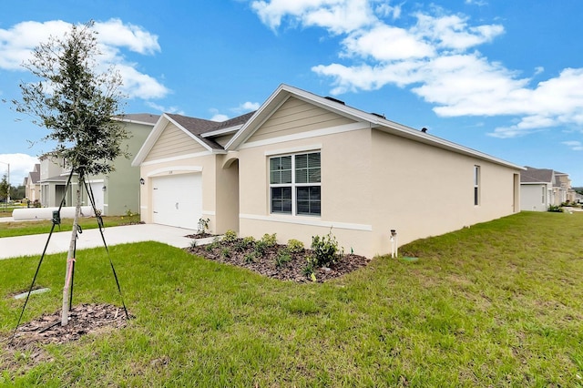 exterior space featuring a front lawn and a garage