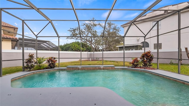 view of pool featuring pool water feature, a lanai, and a lawn