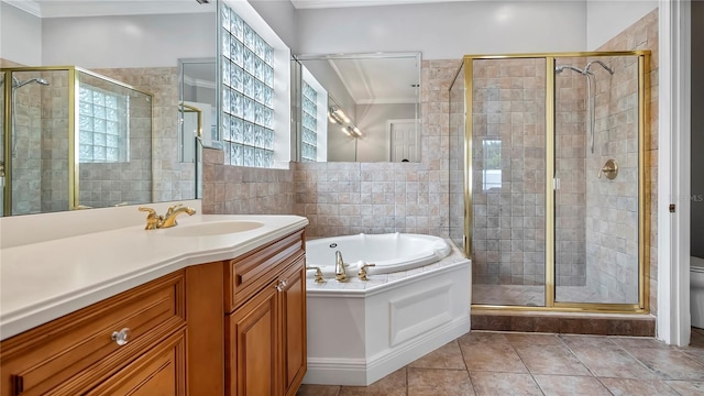 full bathroom featuring vanity, plus walk in shower, tile patterned floors, crown molding, and toilet