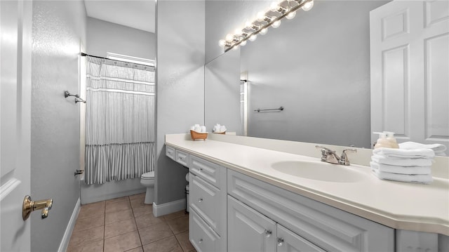 full bathroom featuring tile patterned flooring, vanity, toilet, and shower / bath combo with shower curtain