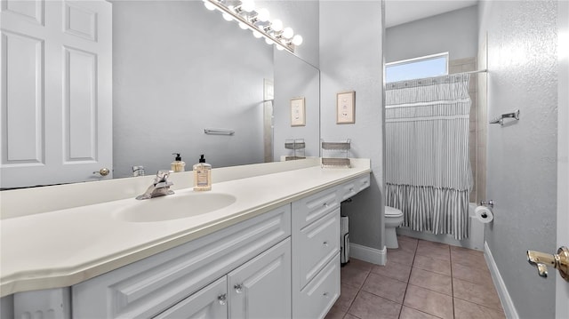 full bathroom featuring tile patterned floors, vanity, shower / bath combination with curtain, and toilet