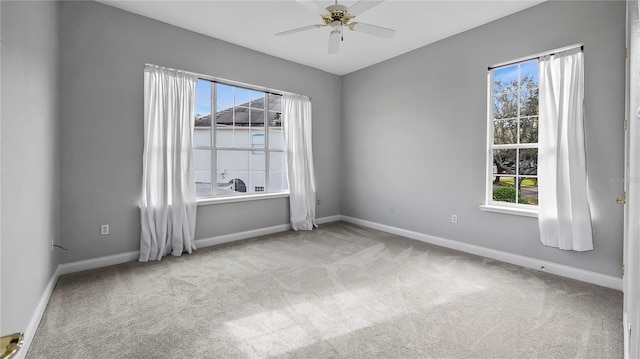 carpeted empty room with ceiling fan