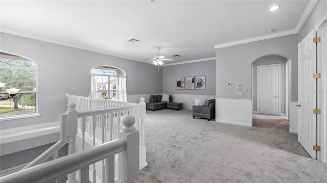 interior space featuring crown molding and ceiling fan