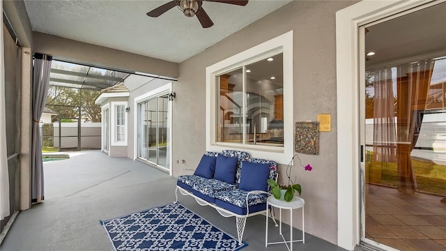 sunroom / solarium featuring ceiling fan