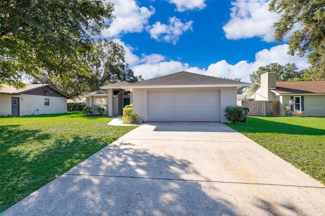 single story home featuring a front yard and a garage