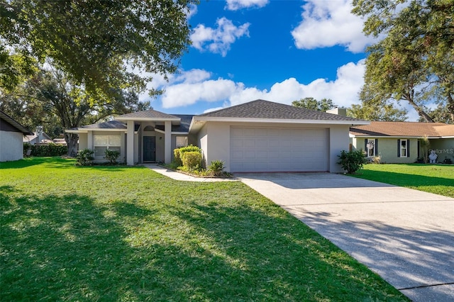 ranch-style house featuring a front lawn and a garage