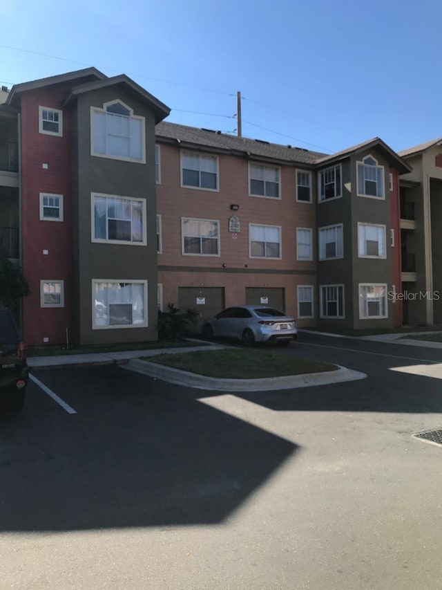 2202 Key W Ct Unit 632, Kissimmee, FL 34741 - view of property with uncovered parking