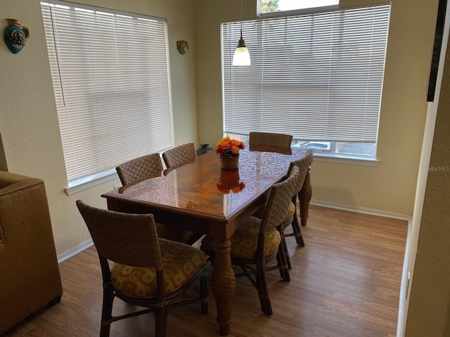 2202 Key W Ct Unit 632, Kissimmee, FL 34741 - dining area with healthy amount of natural light and wood finished floors