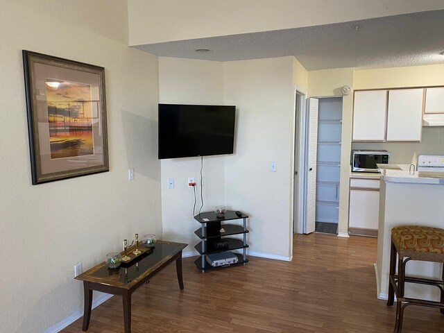 2202 Key W Ct Unit 632, Kissimmee, FL 34741 - living area with dark wood-style floors and baseboards