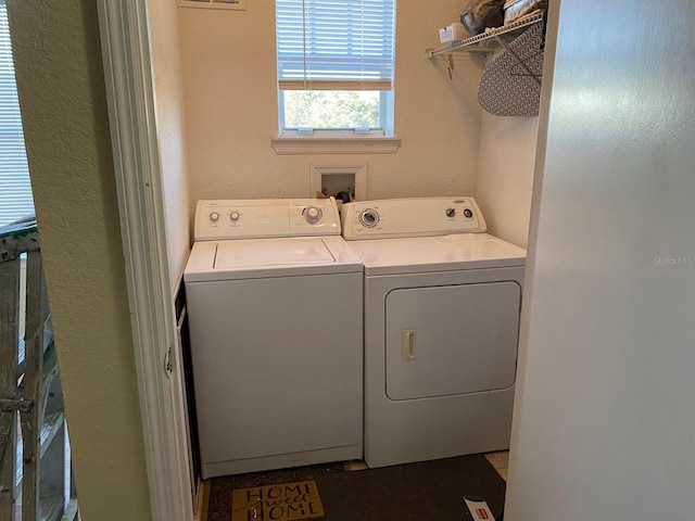 laundry area with washing machine and dryer