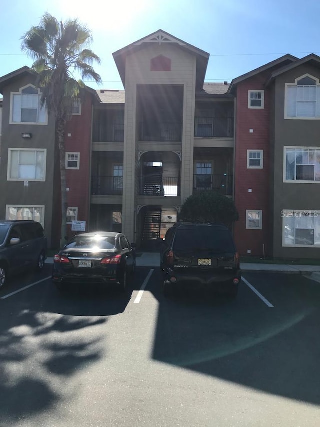 2202 Key W Ct Unit 632, Kissimmee, FL 34741 - view of building exterior with uncovered parking