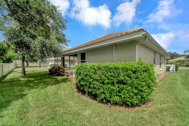 view of property exterior featuring a lawn