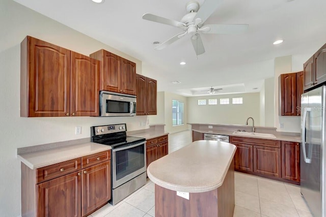 kitchen with ceiling fan, light tile patterned floors, sink, and appliances with stainless steel finishes