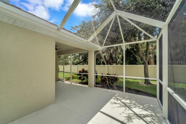 unfurnished sunroom featuring lofted ceiling