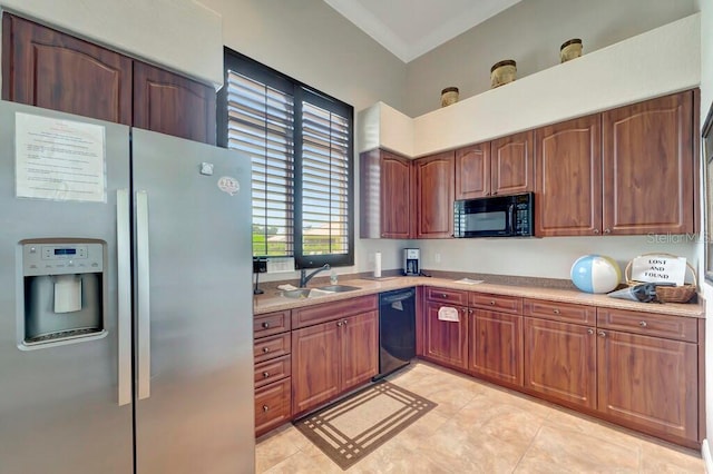 kitchen with sink and black appliances