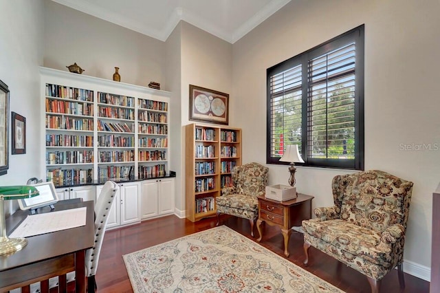 sitting room featuring dark hardwood / wood-style floors and crown molding