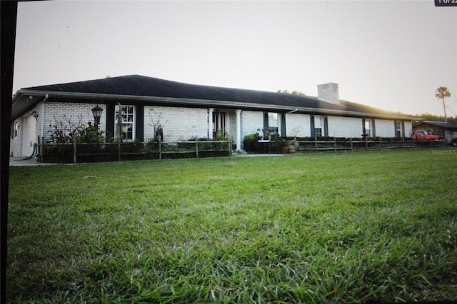 back of house featuring a yard