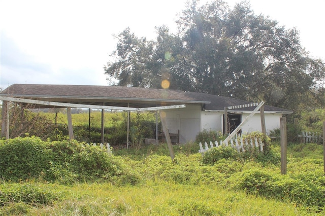 exterior space featuring a carport