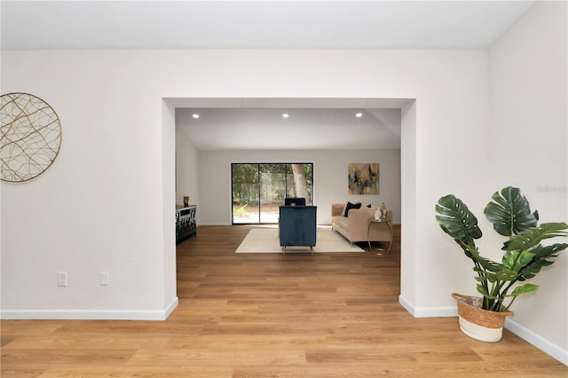 hall with light hardwood / wood-style flooring