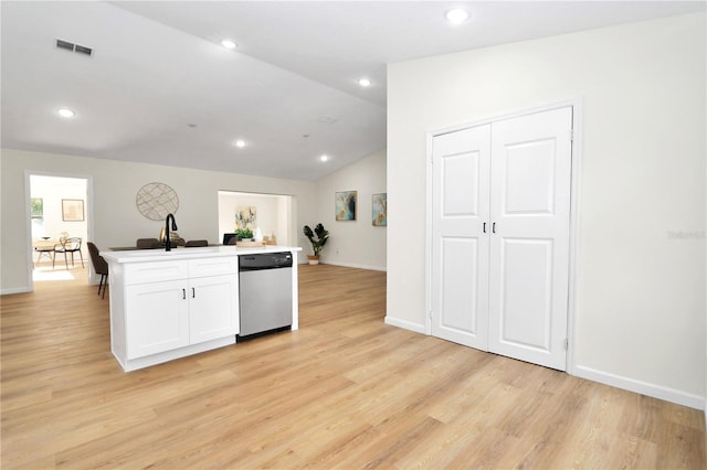 kitchen featuring dishwasher, light hardwood / wood-style floors, vaulted ceiling, and white cabinets