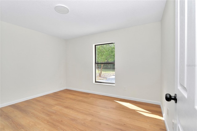 unfurnished room with light hardwood / wood-style floors