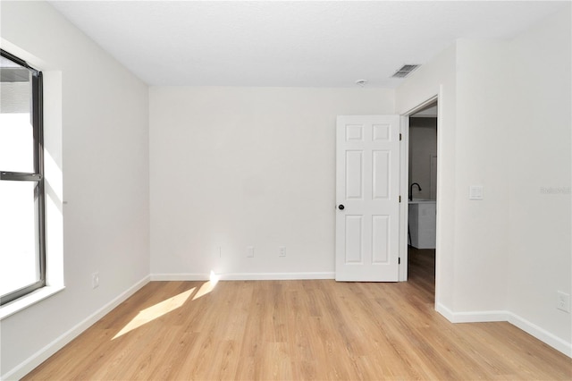 empty room with light hardwood / wood-style floors