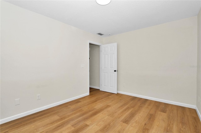 unfurnished room featuring light hardwood / wood-style floors