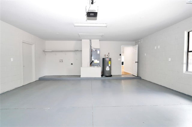 garage featuring heating unit, a garage door opener, and water heater