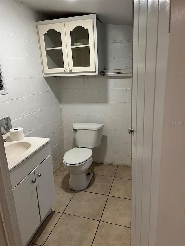 bathroom with tile patterned floors, vanity, and toilet