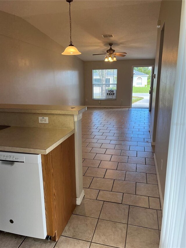 kitchen featuring pendant lighting, white dishwasher, light tile patterned floors, and ceiling fan