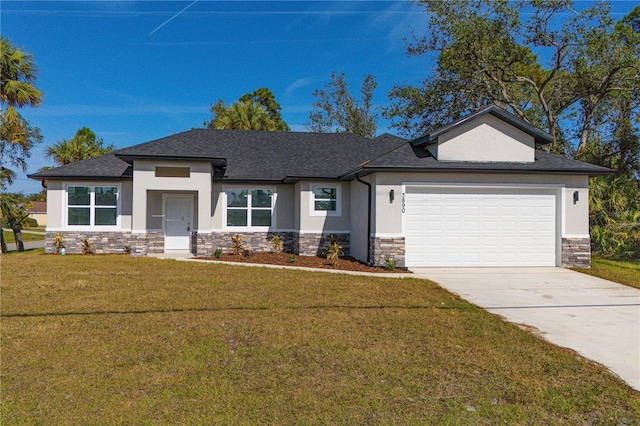 view of front of house with a garage and a front yard