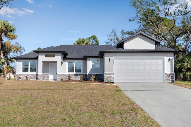 view of front of home featuring a garage and a front lawn