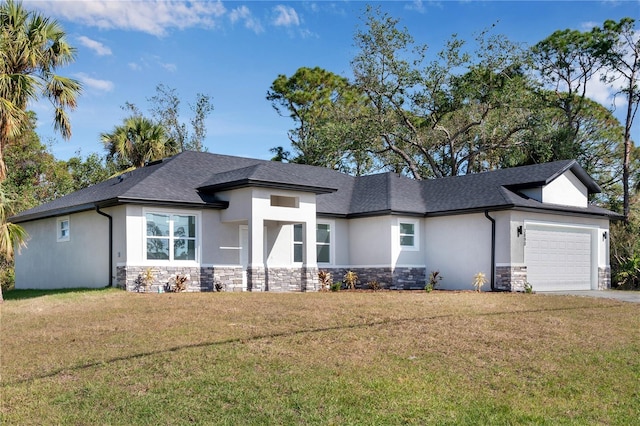 view of front of home with a garage and a front lawn