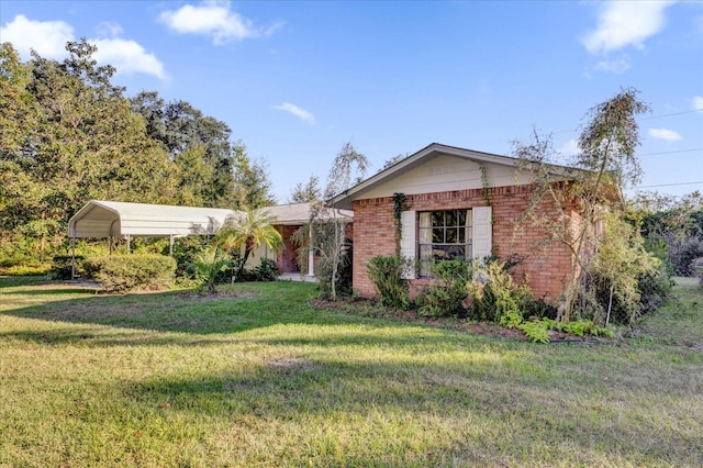 view of front facade featuring a front lawn and a carport