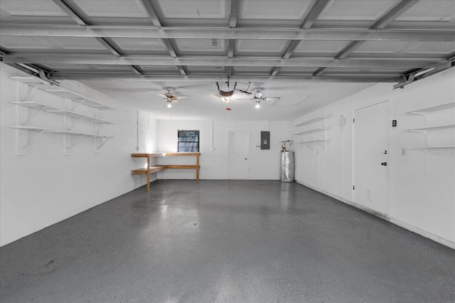 garage with electric panel, ceiling fan, a garage door opener, and gas water heater