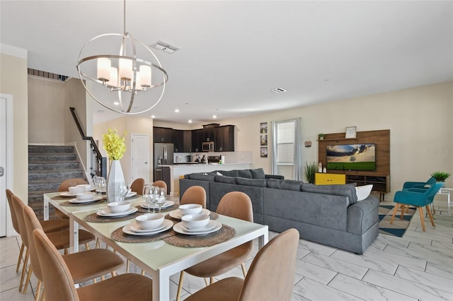 dining space with a notable chandelier