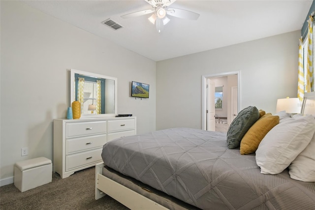 bedroom with carpet flooring, connected bathroom, and ceiling fan