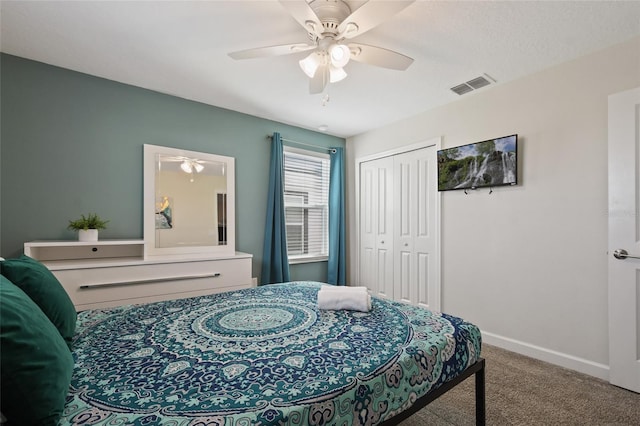 bedroom with carpet, a closet, and ceiling fan