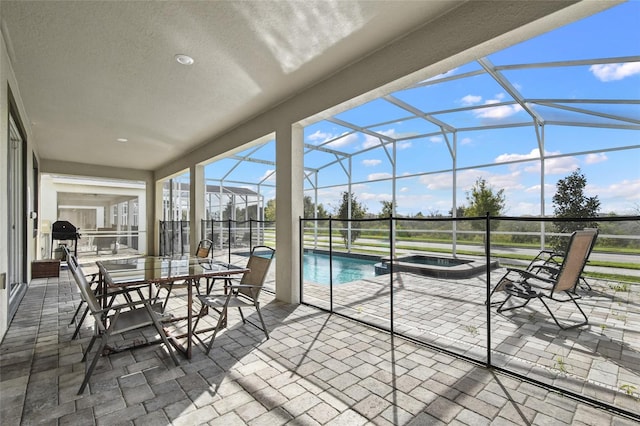 sunroom featuring a swimming pool