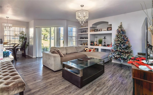 living room with a chandelier and hardwood / wood-style flooring