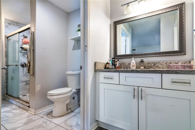 bathroom featuring toilet, vanity, and walk in shower