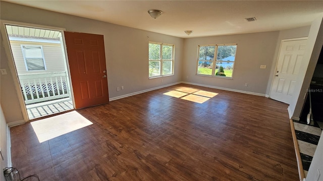 foyer entrance with dark hardwood / wood-style floors