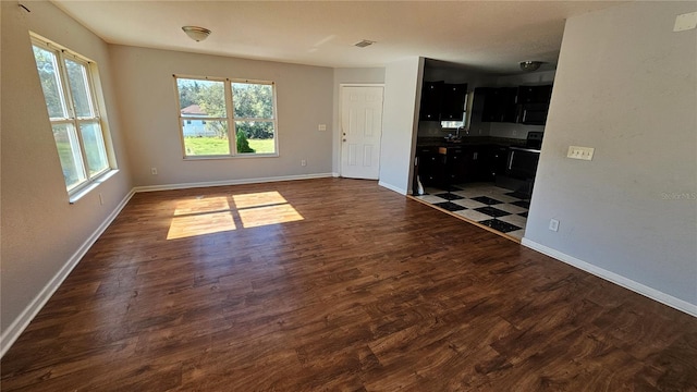 empty room with dark wood-type flooring