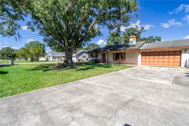 single story home with a garage, a porch, and a front yard