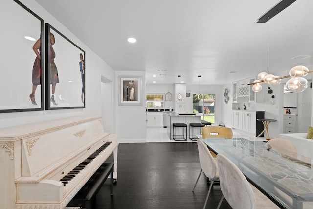 dining area featuring dark wood-type flooring