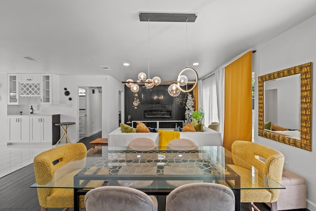 dining space featuring tile patterned flooring and indoor wet bar