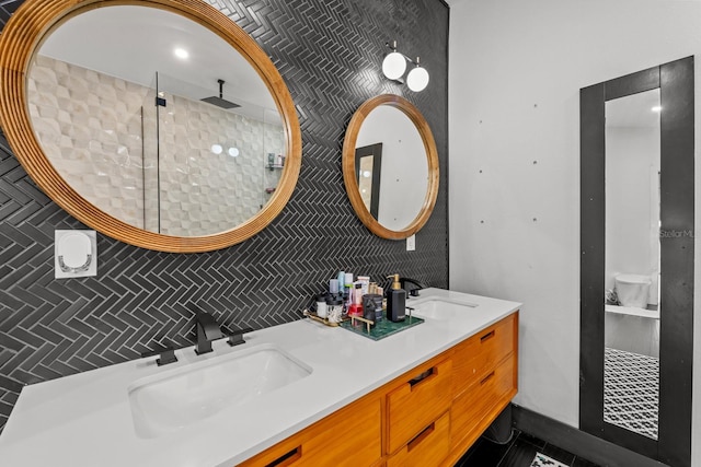 bathroom featuring decorative backsplash and vanity