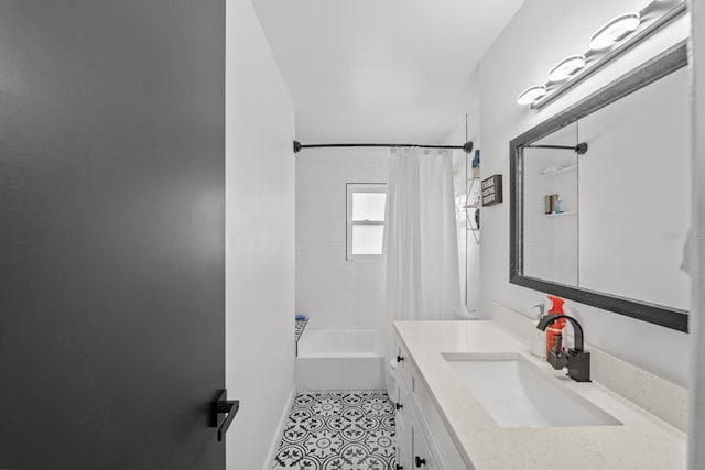 bathroom featuring tile patterned floors, shower / bath combo, and vanity