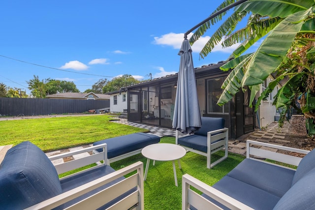 view of yard featuring a sunroom